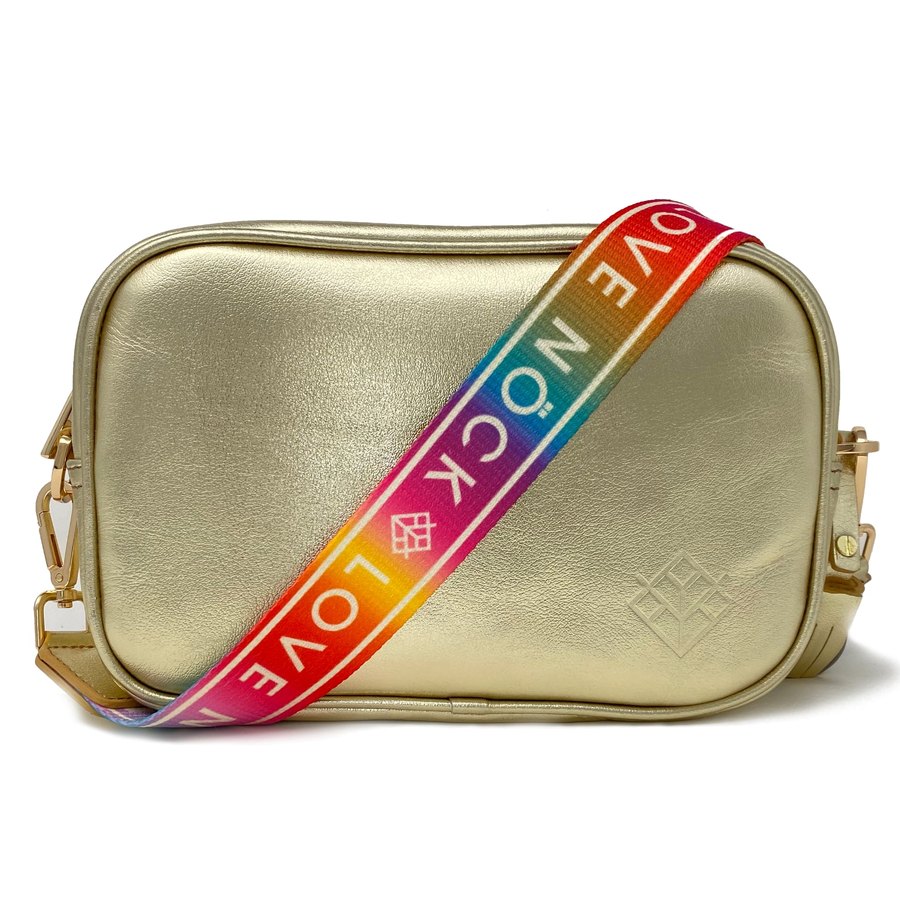 The NÖCK wordmark woven into the strap of a crossbody bag